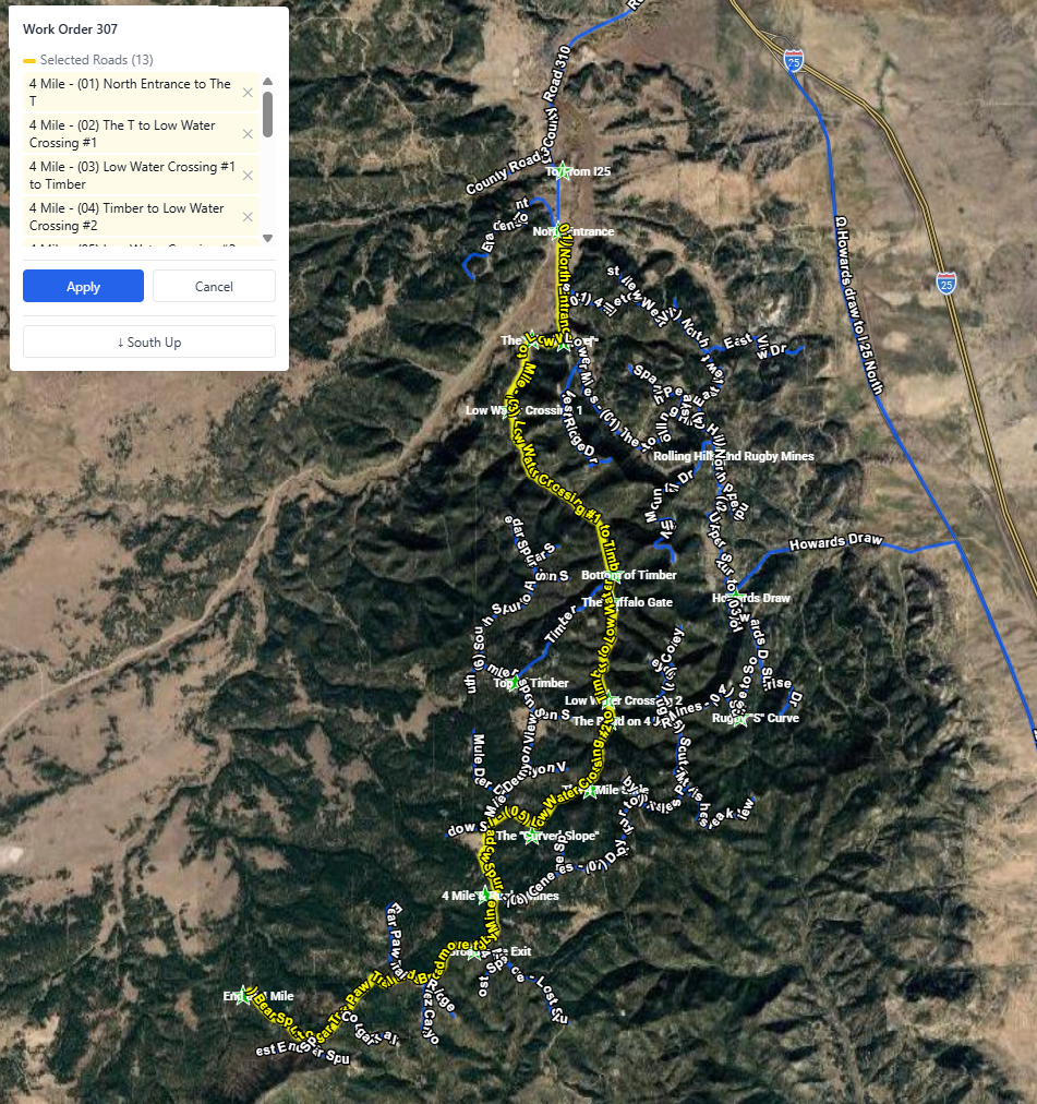 GROOM work order — gravel road segment highlighted on interactive satellite map for field crew navigation